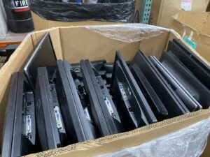A box filled with flat-screen computer monitors for recycling at R3Ewaste in Phoenix, AZ