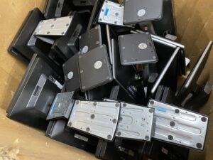 A box filled with monitor stands and bases, collected as e-waste by R3Ewaste in Phoenix, AZ