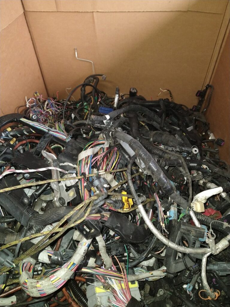 A large box filled with automotive wiring harnesses for scrap recycling at Mid Atlantic Recycling Solutions, LLC in Norfolk, VA.