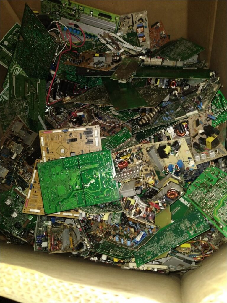 A large box filled with circuit boards and e-waste for recycling at Mid Atlantic Recycling Solutions, LLC in Norfolk, VA.