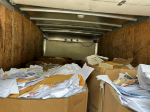 The interior of a box truck filled with paper and documents for recycling by E&k logistics an Recycling LLC in Hoover, AL.