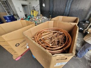 Cardboard boxes filled with copper pipes and metal scraps at Nevada Recycling Henderson in Henderson, NV