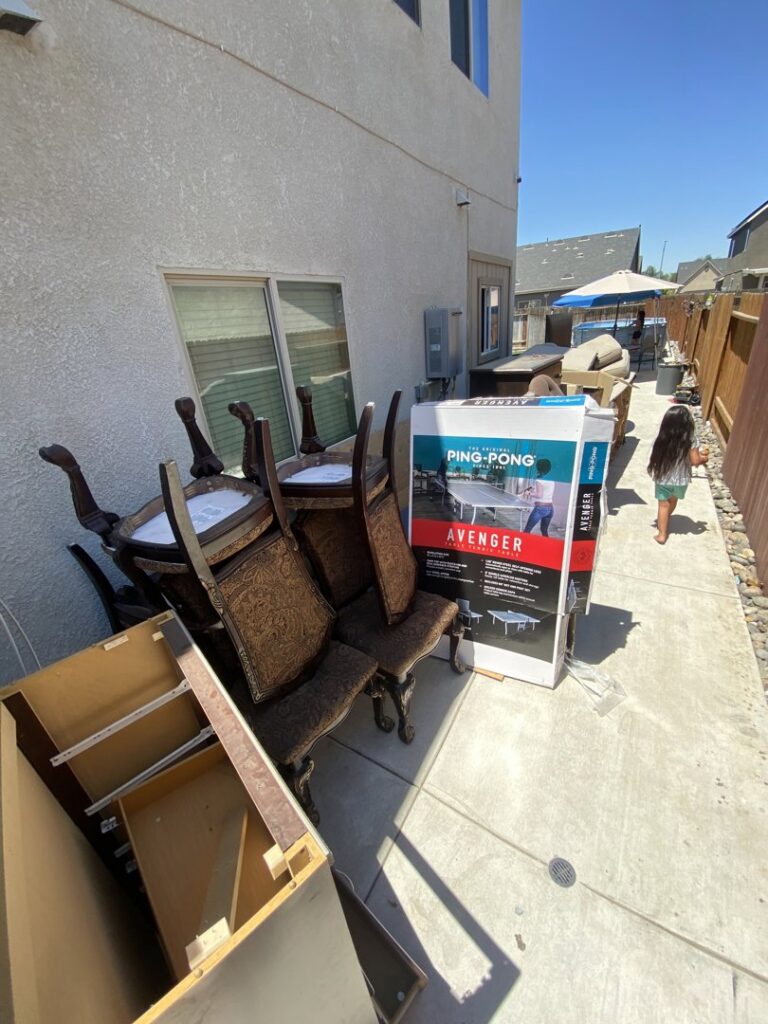 A branded junk removal truck from Area 661 Hauling parked, ready for service in Bakersfield, CA.