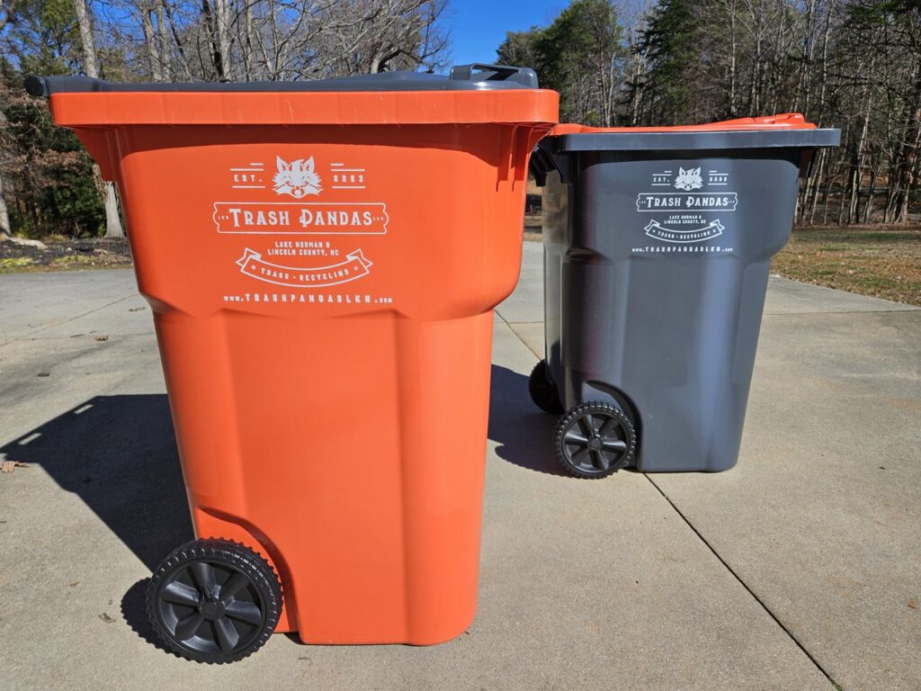 Two branded trash and recycling bins from Trash Pandas LKN, ready for service in Charlotte, NC.