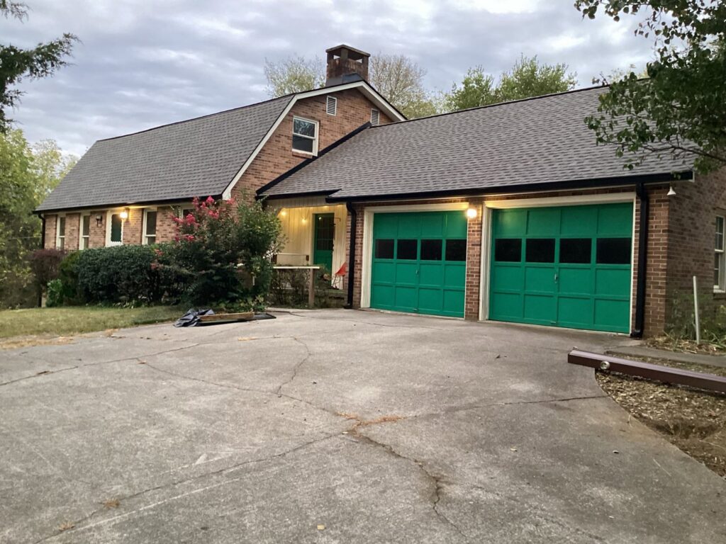 A brick home showcasing a new roof installed by Innovative Roofing & Siding Inc in Knoxville, TN.