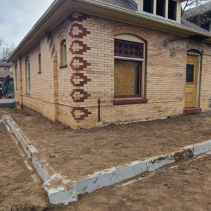 Renovation work on a brick house foundation by JL Harris Enterprises, LLC, providing handyman services in Denver, CO