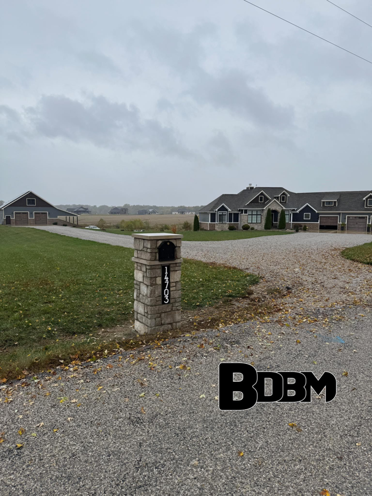 A custom brick mailbox with house number 14703 installed by Big Dicks Brick Mailboxes in St. Louis, MO.