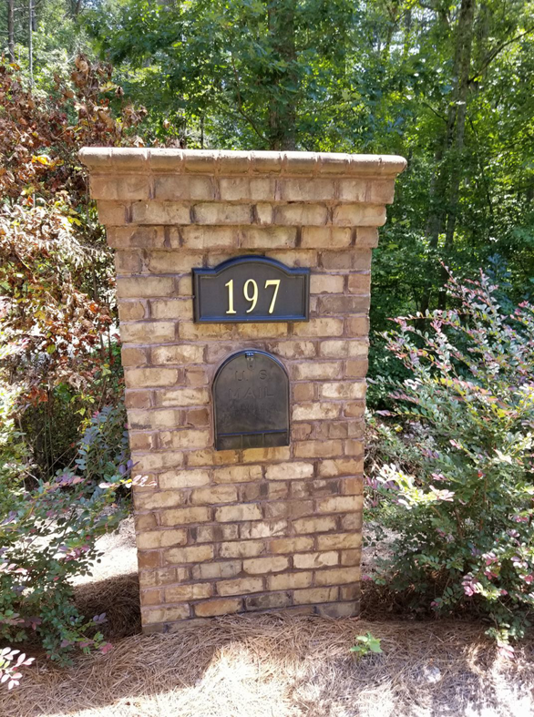 A newly constructed brick mailbox pillar with house number 197 by B&J Masonry in Winston Salem, NC.