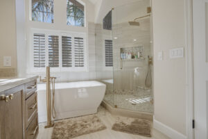A bright, modern bathroom renovation with a freestanding tub and glass shower by Integrity Contracting in Cleveland, OH