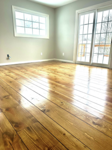 Bright room showcasing beautifully refinished pine floors by WoodHaven Floor Refinishing in Georgetown, KY.