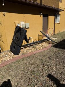 A broken basketball hoop and other debris ready for removal by Lightning Bay Junk Removal in Tampa, FL.