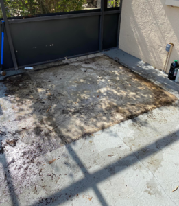 An old, broken hot tub with damaged wooden skirting on a patio, awaiting removal by Junk Pros Junk Removal in Tampa, FL.