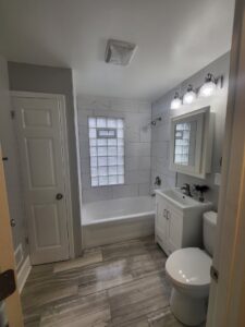 A close-up of a broken wooden fence needing repair, a service offered by Advance Construction Builders, LLC in Milwaukee, WI.