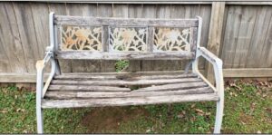 A broken wooden garden bench with a damaged seat, ready for repair by I Know A Guy Handyman Service, Cottage Grove, MN.
