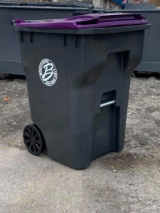A grey residential trash bin with the Brothers Disposal, LLC logo for waste collection in Cumberland, RI.