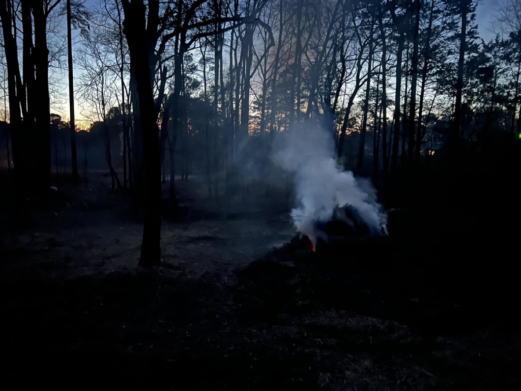 A brush pile burning during cleanup after tree service work by Tony's Tree Service LLC in York, SC