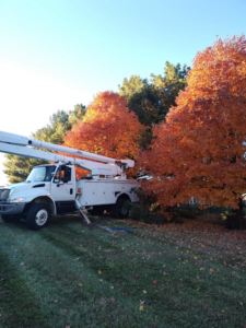 A bucket truck used for tree trimming services by Hoffman Construction Services, LLC in Saint Joseph, MO.