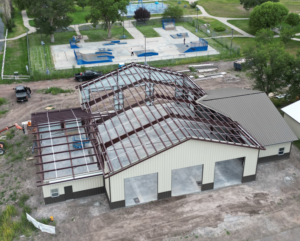 Aerial view of building roof framing and construction in progress by Black Pearl Construction in Post Falls, ID