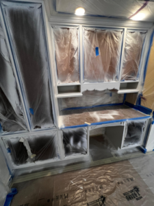 Built-in cabinets and desk area protected for painting by GD Home Remodeling in Annadale, VA.