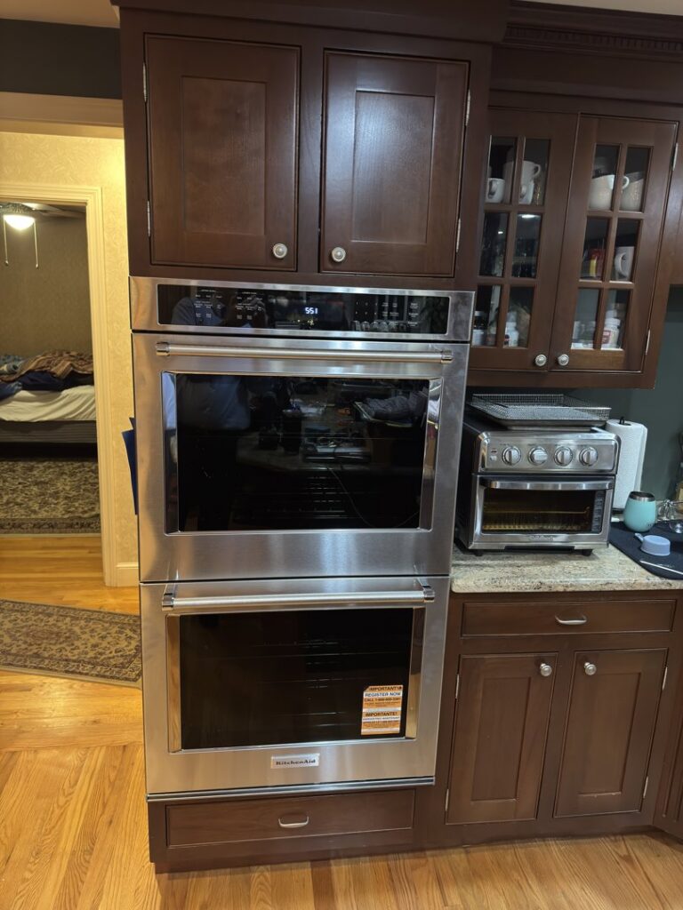 A new built-in double oven expertly installed in kitchen cabinetry by R&J Handyman Services LLC in Warwick, RI.