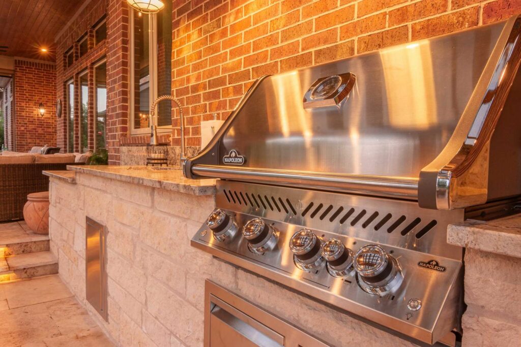 A close-up of a built-in outdoor grill and countertop by Houston Home Improvements & Construction in Houston, TX