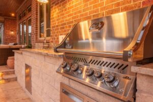 A close-up of a built-in outdoor grill and countertop by Houston Home Improvements & Construction in Houston, TX