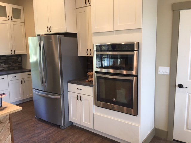 New built-in oven and refrigerator installation in a kitchen, a handyman service by TPF Services in Yakima, WA.