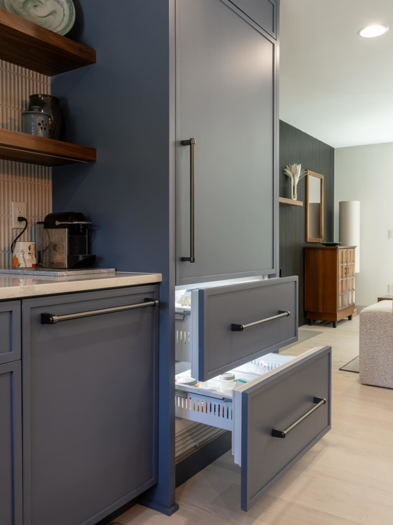 Built-in refrigerator drawers integrated into blue kitchen cabinets by JDI Construction in Vancouver, WA.