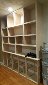 A built-in shelving unit under construction or installation by Quality Services, LLC in Alexandria, VA.