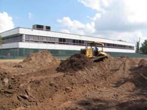 A bulldozer performing earthmoving and site preparation in Houston, TX, by Daniel Dean Land Clearing & Dirt Work.