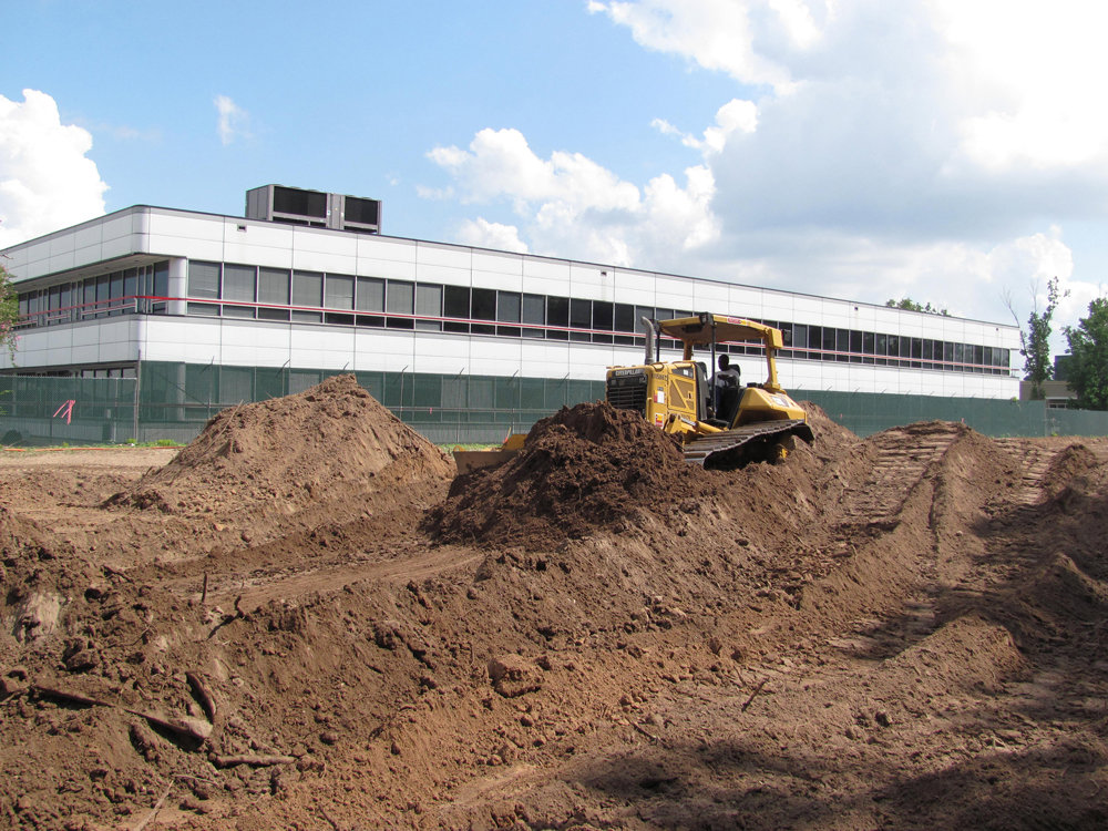 A bulldozer performing earthmoving and site preparation in Houston, TX, by Daniel Dean Land Clearing & Dirt Work.