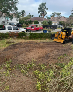 S & J Stump Removal LLC truck and stump grinder at a job site in Shreveport, LA, after a stump removal service.