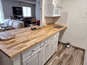 New butcher block countertops installed in a kitchen, a service provided by Just-In-Time Handyman Services in Honolulu, HI.