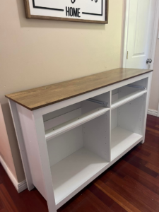 A white cabinet frame partially assembled, showing the structure before drawers and doors are added by Assembly Required in Summerville, SC.