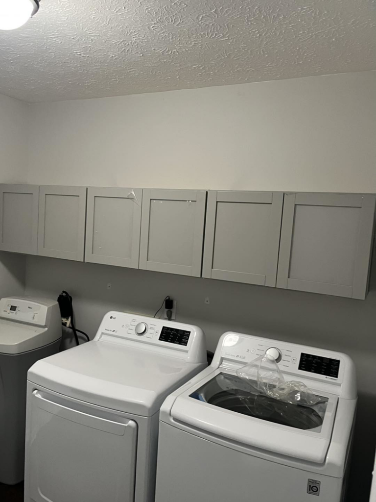 Newly installed cabinets in a laundry room by Jeff of all Trades LLC in Carmel, IN