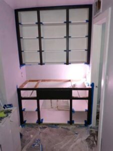 Cabinet installation and painting in progress by Vermont Professional Solutions LLC in South Burlington, VT.