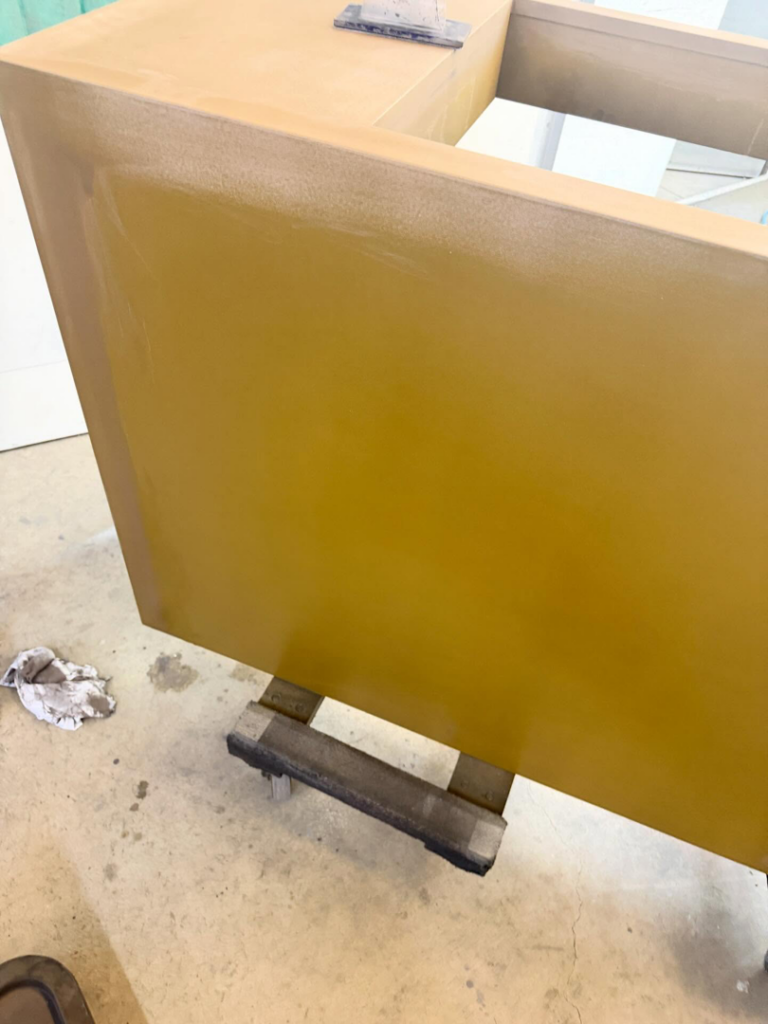 Side view of a cabinet being refinished as part of a handyman project by Bespoke Finish in Minneapolis, MN.