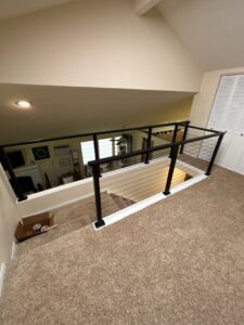 Interior cable railing system installation on a staircase by Panhandle Contracting Co. in Rathdrum, ID