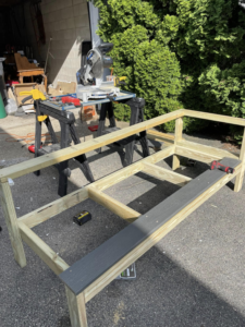 Carpentry work in progress, building a wooden bench with power tools by Digby Handyman Services LLC in Cranston, RI.