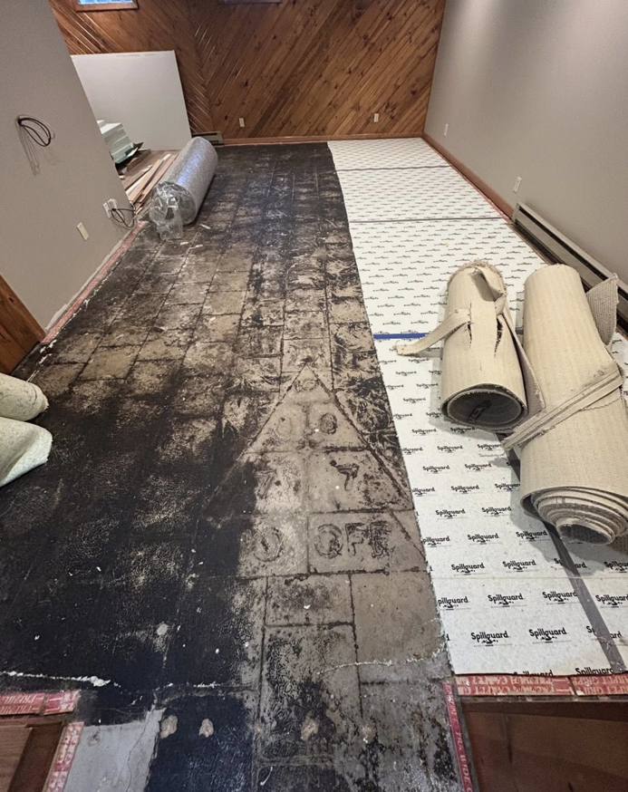 Carpet installation in progress with new padding laid by I Need a Guy Handyman Services LLC in Moorhead, MN