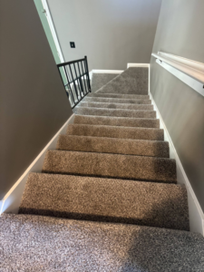 Professional carpet installation in a residential stairwell by DC Home Solutions in Atlanta, GA.