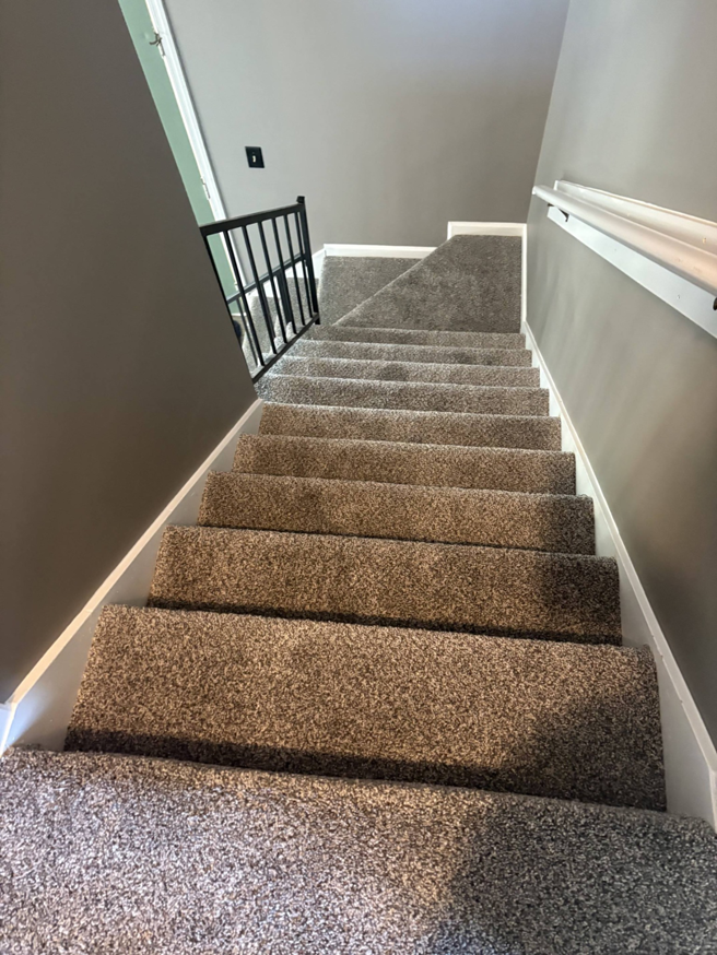 Professional carpet installation in a residential stairwell by DC Home Solutions in Atlanta, GA.
