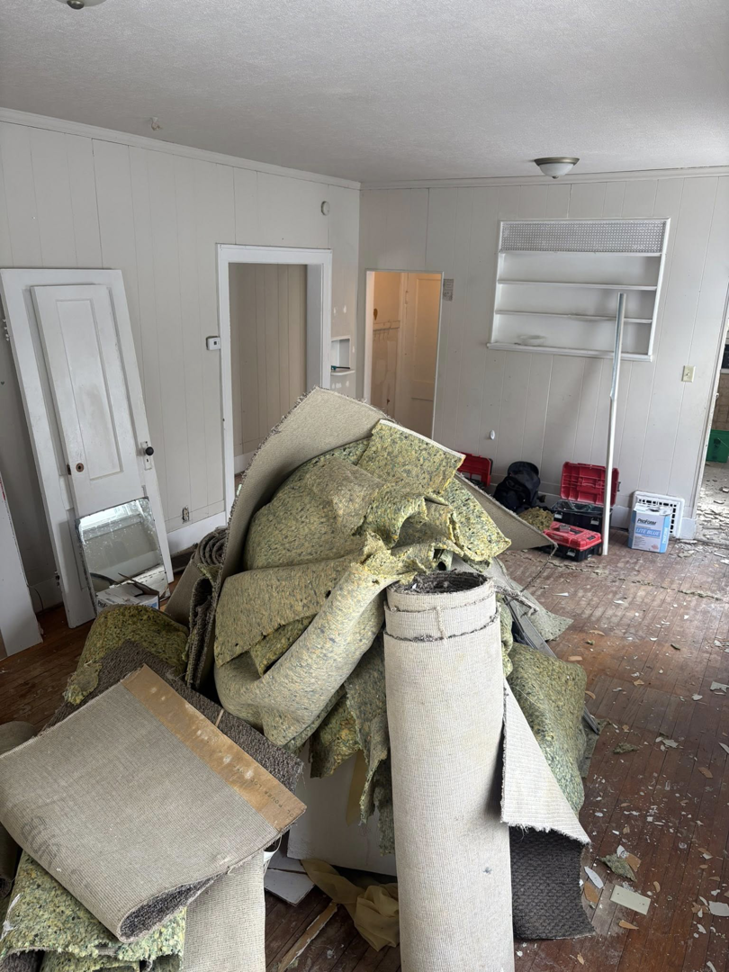 Old carpet and padding removed during a flooring project by John Oliver Rose & Co. in South Bend, IN