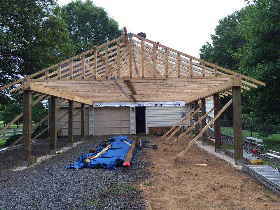 A carport roof framing project in progress, showcasing construction services by Mason Home Improvement Inc. in Newport News, VA.