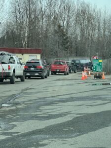 Cars lined up at a waste drop-off facility for Municipality of Anchorage Solid Waste Services in Anchorage, AK.