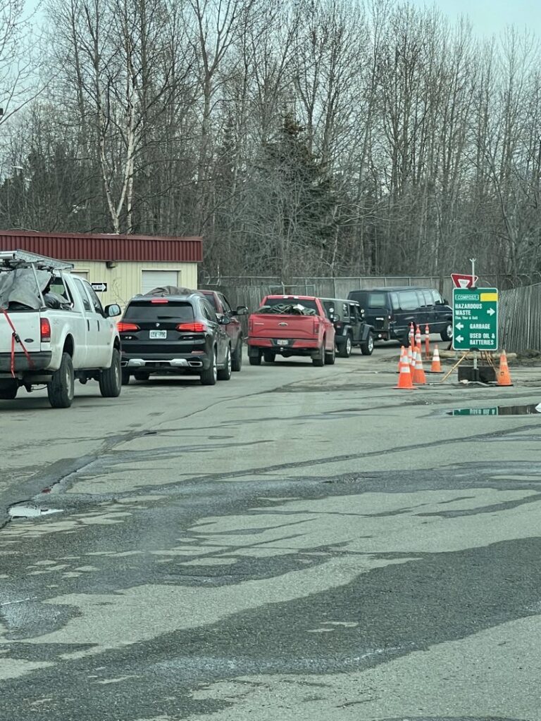 Cars lined up at a waste drop-off facility for Municipality of Anchorage Solid Waste Services in Anchorage, AK.