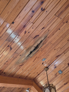 A large crack in a wooden ceiling requiring repair by E and C Handyman and Construction LLC in Owensboro, KY.