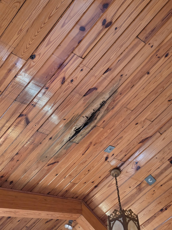 A large crack in a wooden ceiling requiring repair by E and C Handyman and Construction LLC in Owensboro, KY.