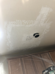 Ceiling drywall patch around a recessed light fixture by Fonseca's Drywall, LLC in Glendale, AZ