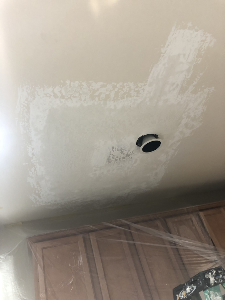 Ceiling drywall patch around a recessed light fixture by Fonseca's Drywall, LLC in Glendale, AZ